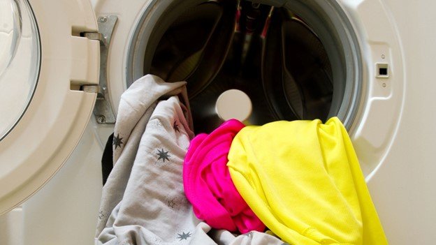 clothes are kept in the laundry for removing pet hair